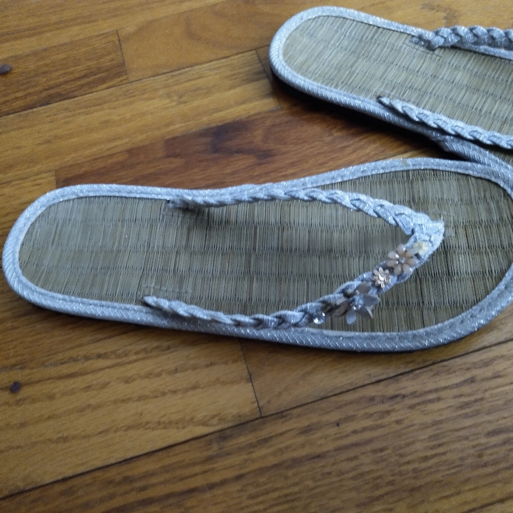 Accessorize floral flip flops